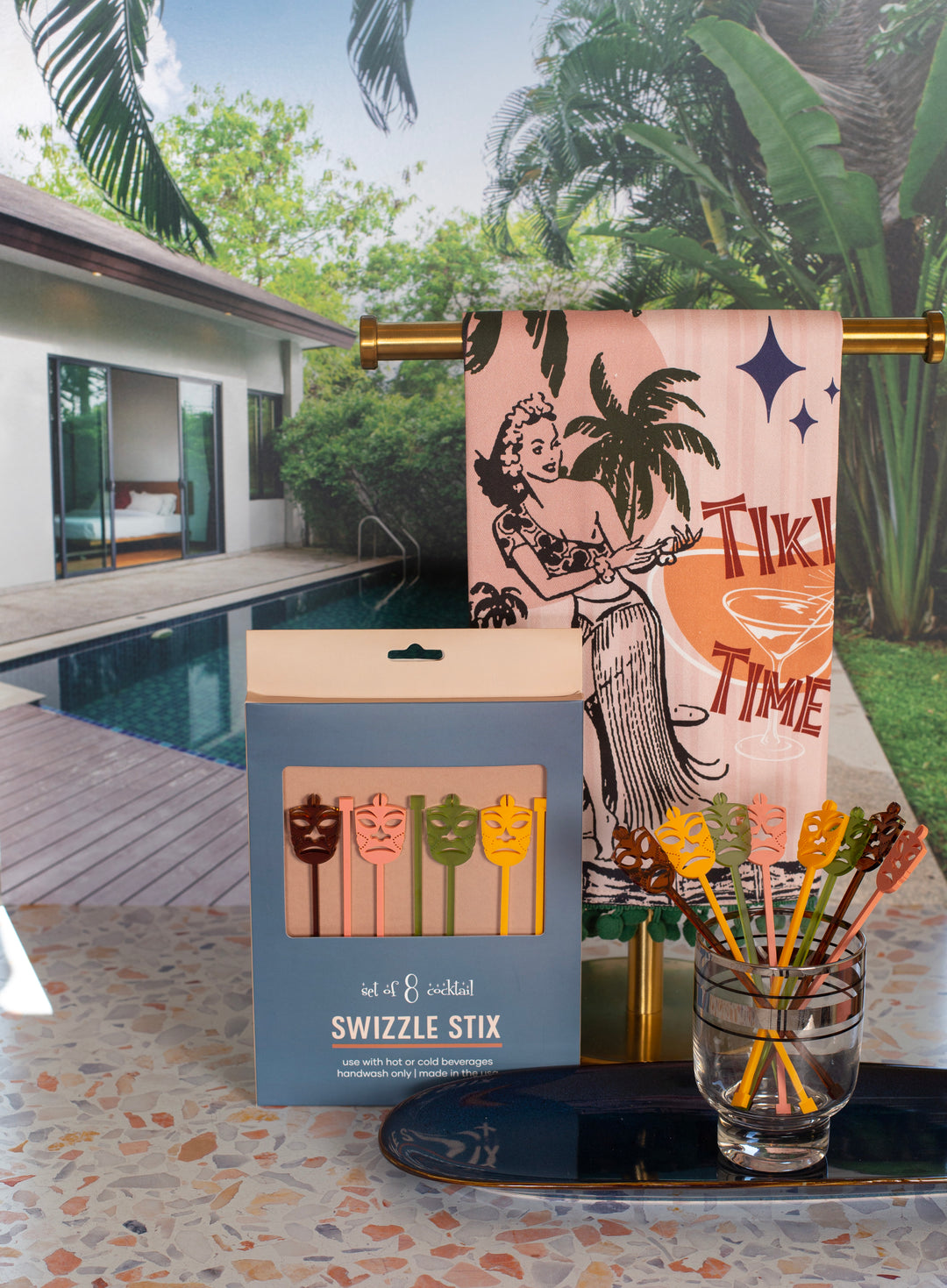 tiki time mid century modern vintage hawaii tea towel with chenille trim - tiki party barware. Shown with tiki head beverage mixing swizzle sticks