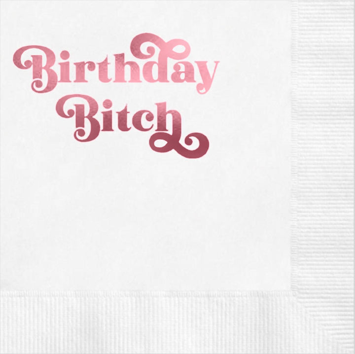 White napkin with funny pink foil text 'Birthday Bitch' 