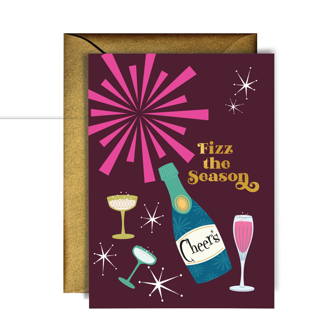 Fizz the Season Mid Century Modern holiday greeting card with gold foil lettering, champagne bottle illustration, and antique gold Euro flap envelope.