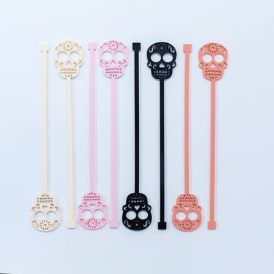 Serve up a fiesta with these fun Pink Skull Beverage Mixing Swizzle Stix! With a trendy pink and blush color palette, they are perfect for Cinco de Mayo and Day of the Dead celebrations or a Fall Sunday brunch day drinking with your gal pals. Say '¡Olé!' while adding a&nbsp;unique, festive flair to every cocktail with these colorful, eye-catching sugar skulls.