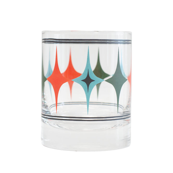 A retro whiskey cocktail rocks glass with a vintage diamond pattern design in red, blue, and green colors along the rim. great house warming or host/hostess gifts.