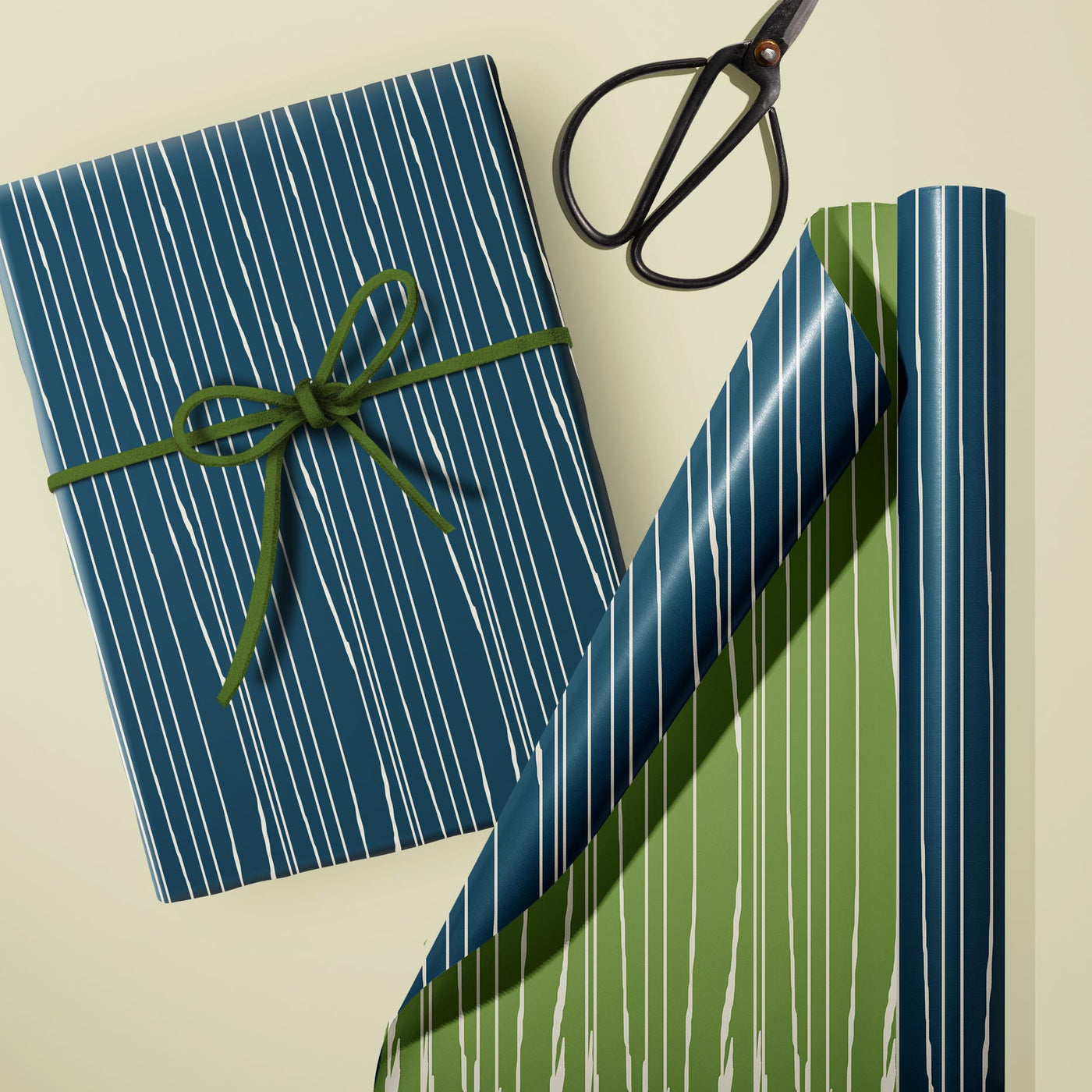 Wrap your gifts in style with our Worn Stripe Blue and Green Double Sided Gift Wrap! This premium quality paper features a mid century modern inspired textural design in both blue and green, perfect for any occasion or DIY craft project. The luxe finish adds a touch of elegance to for any gift giving event.