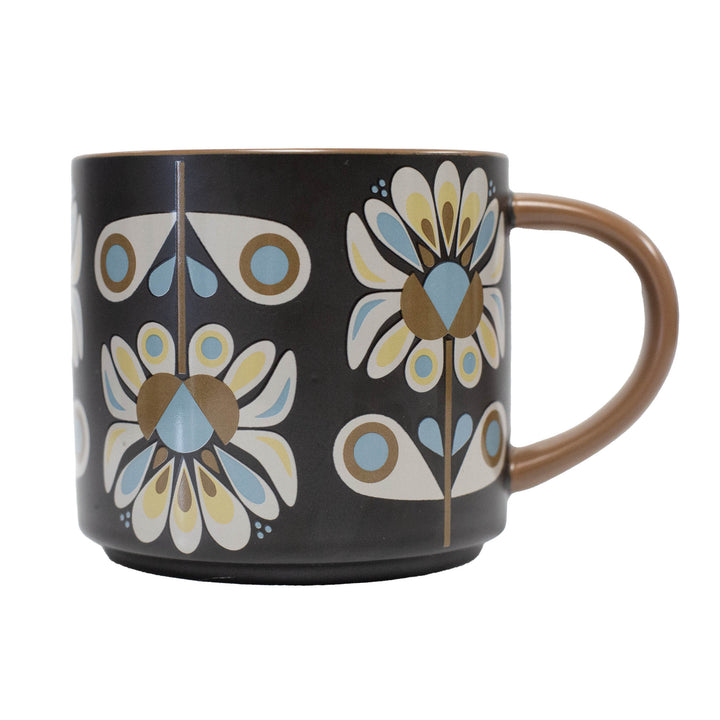 Black mug with a mid century modern floral pattern. Stackable matte mug