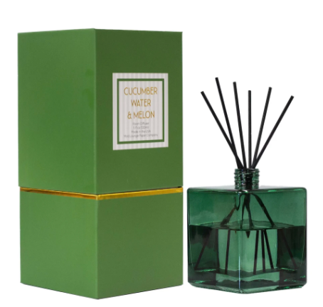 Cucumber Water &amp; Melon reed diffuser in a green square glass jar with black reeds and coordinating gift box