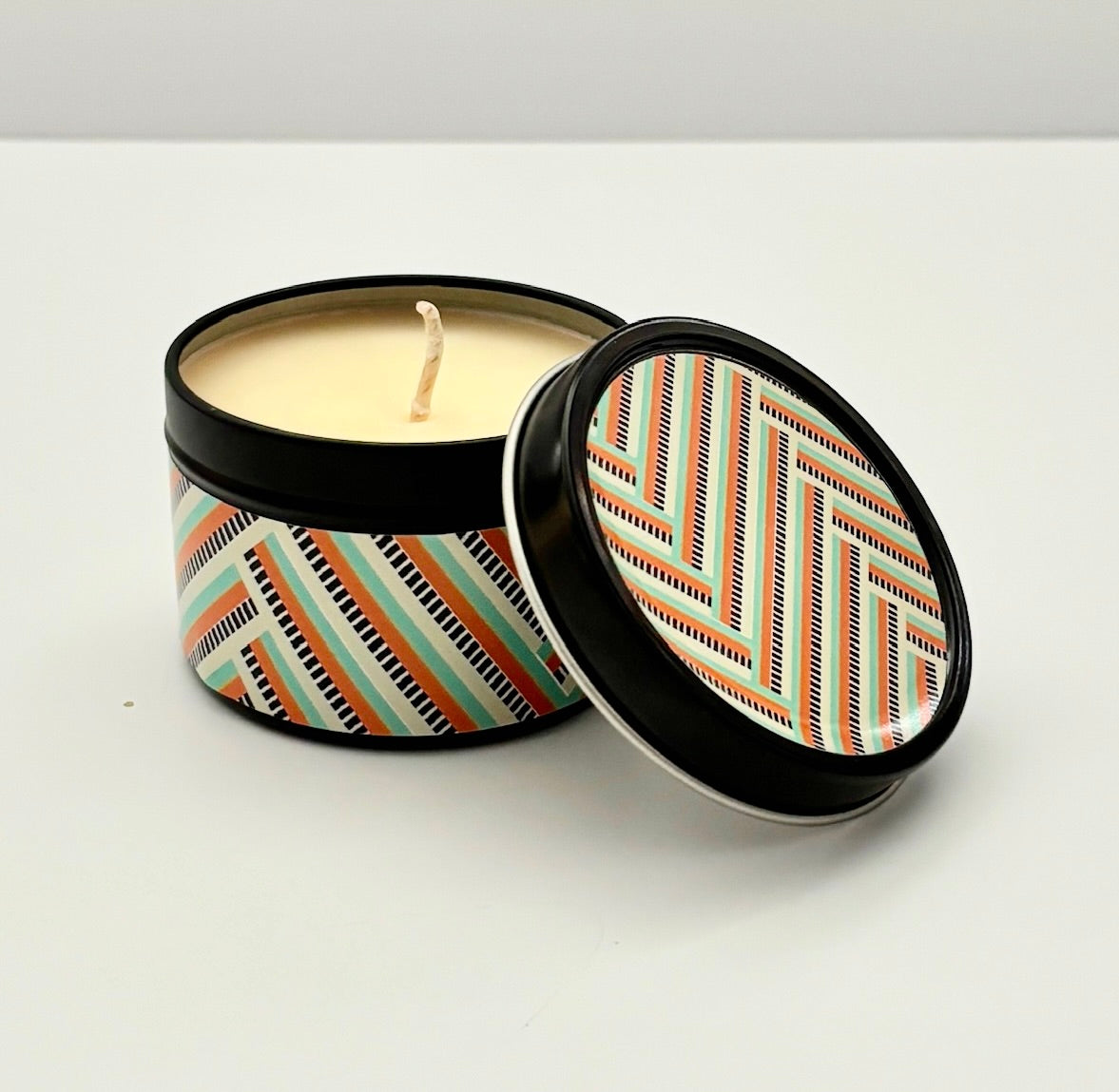 This travel candle boasts a sleek silver tin and a mid century modern design that will bring a sense of Zen to any trip. Experience the calming glow and soothing scents of cucumber and melon relaxation with every journey. Makes a great teacher, co-worker, host/hostess or housewarming gift.