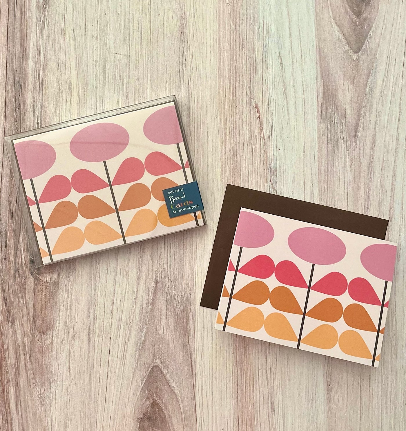 Add a pop of color to your correspondence with our Pink Mod Flower Notecard! Featuring a charming mid century modern teardrop flower pattern in a monochromatic pink and orange warm color palette, it's sure to catch the eye. And with a blank inside, you can personalize each note. Coordinating brown envelope included.