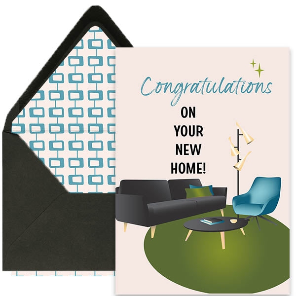 Greeting card with 'Congratulations on your new home!' text and a black envelope with blue geometric pattern.
