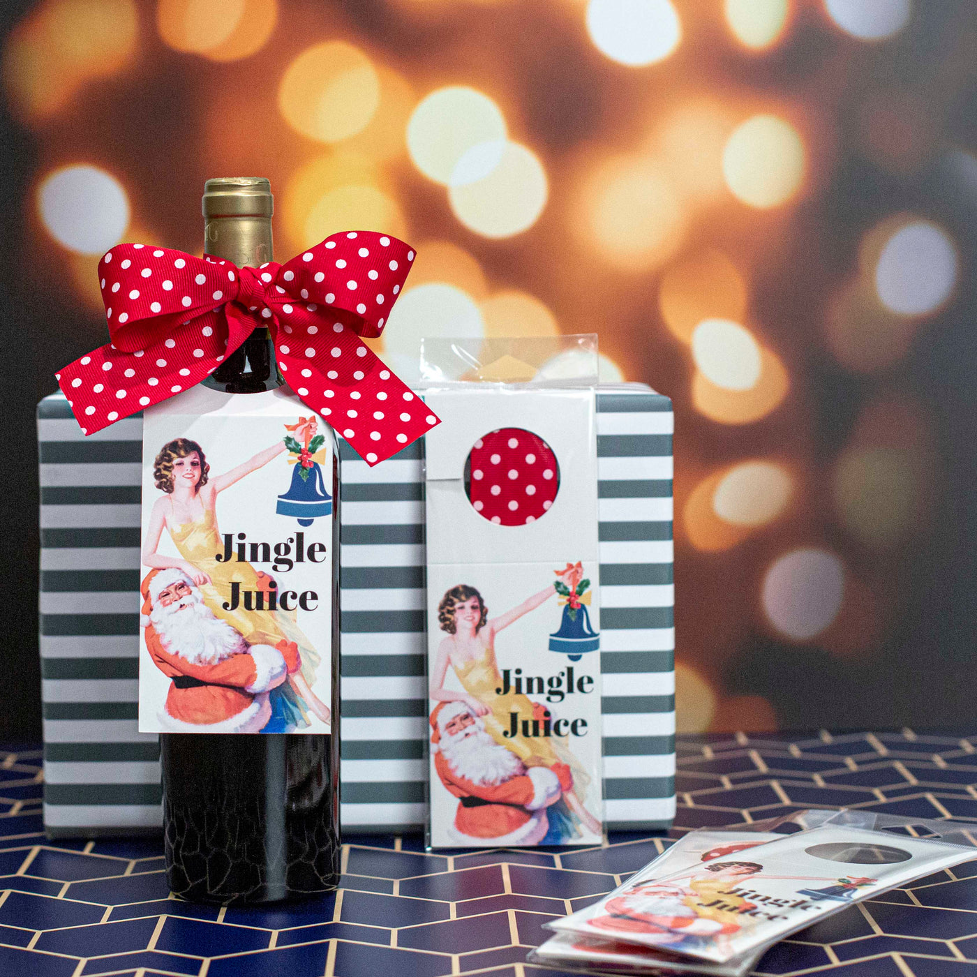 Last minute dinner party? Enhance your holiday spirits with our Jingle Juice Wine Tag! This paper tag features a playful vintage illustration of Santa and cute pinup girl and includes a festive red polka dot bow. The humorous retro text reads "jingle juice", adding a touch of fun to any bottle. Keep some on hand in your car for a last minute stop at the liquor store! Dress It. Gift It. Drink It.