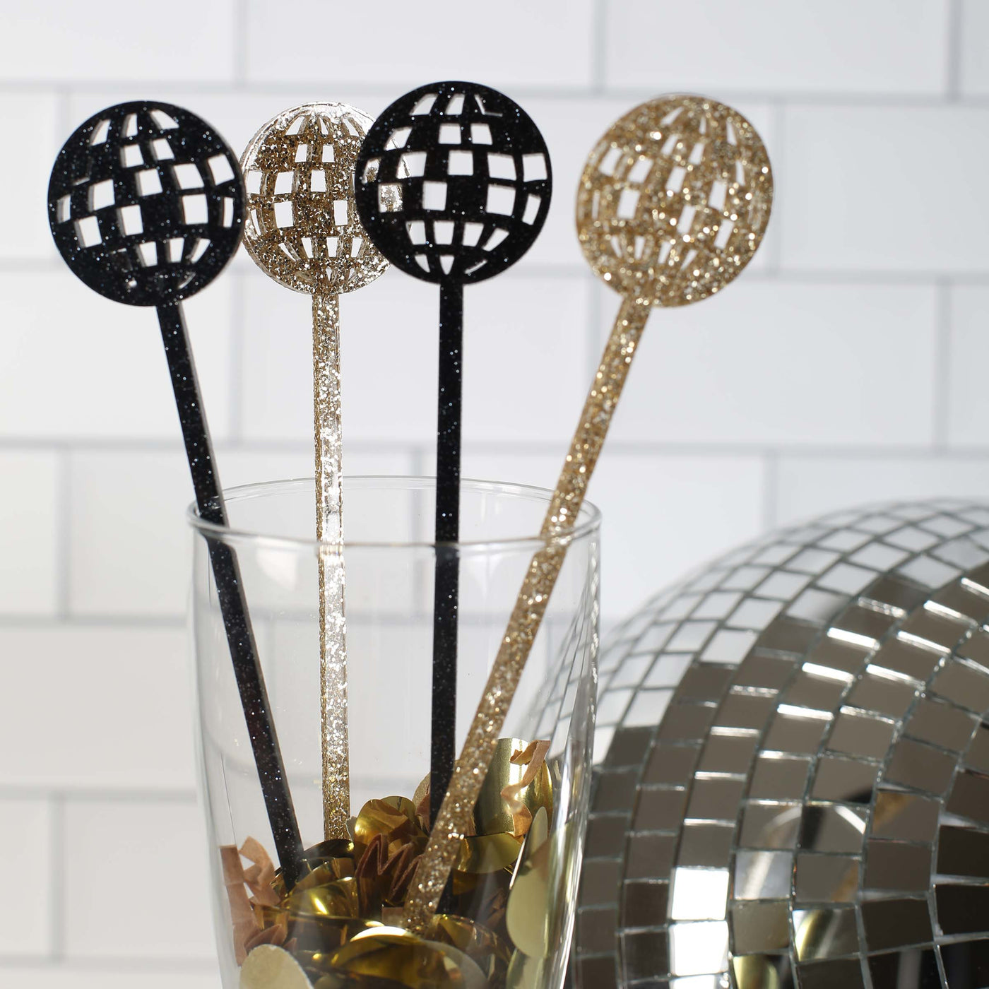 Acrylic disco ball glitter beverage mixing stir sticks. Cocktail swizzle sticks for new years eve, holidays, 70's theme party, bachelorette parties, birthdays or just to jazz up your bar. black and gold glitter colors.