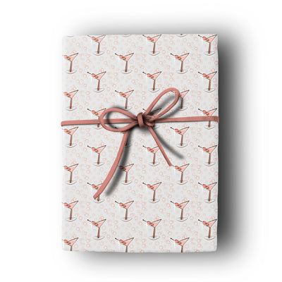 mid century modern pink martini cocktail gift wrap on gray background